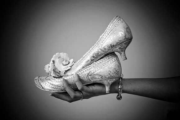 Wedding Shoes in the brides hand